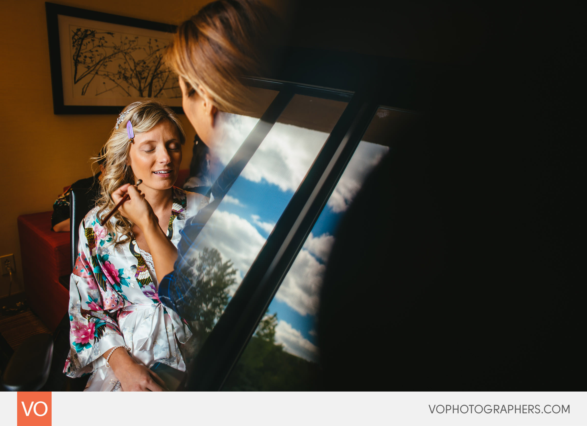 Bride getting her makeup done. Window Reflection