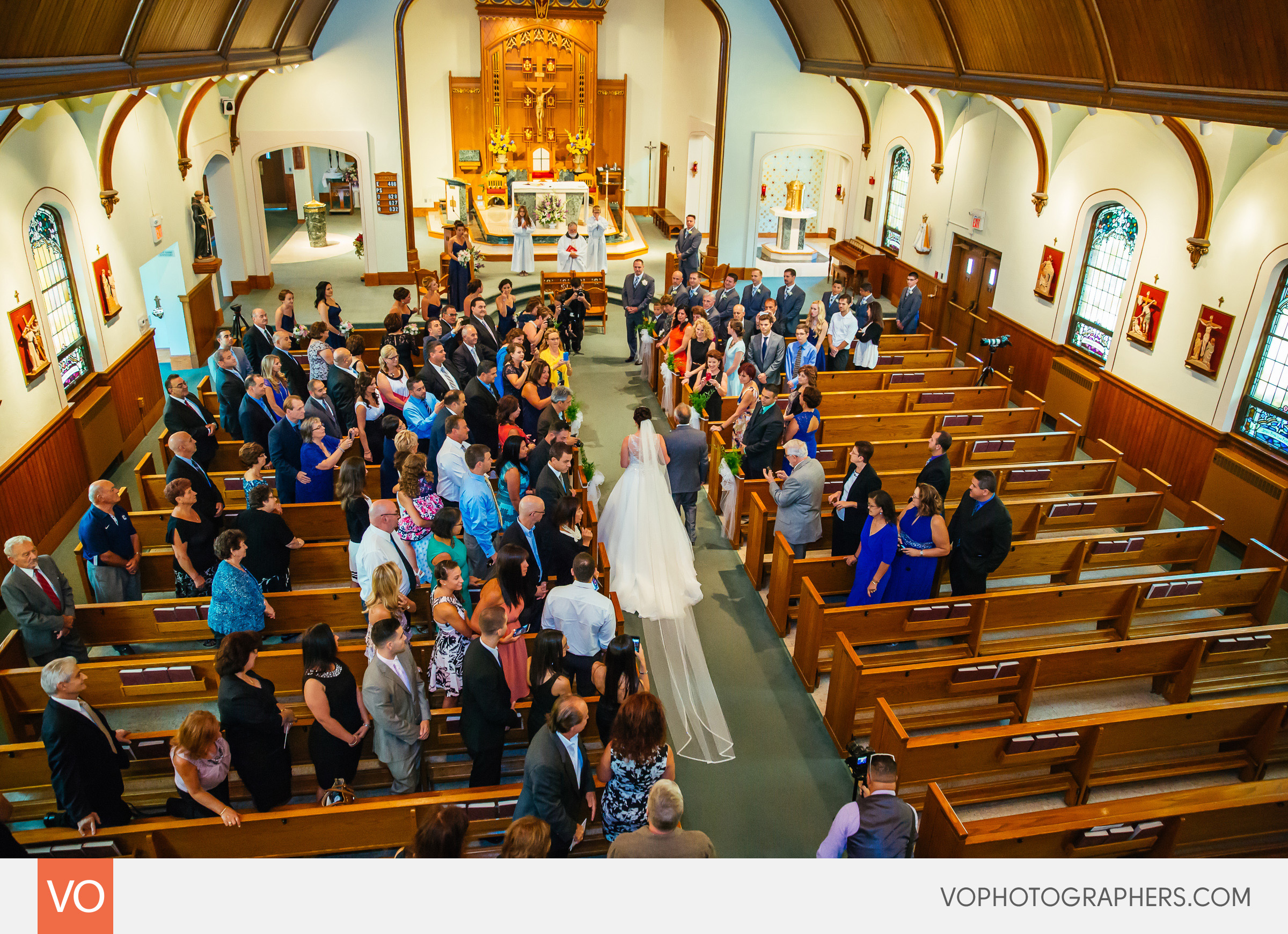 Bride walking into the church with her father