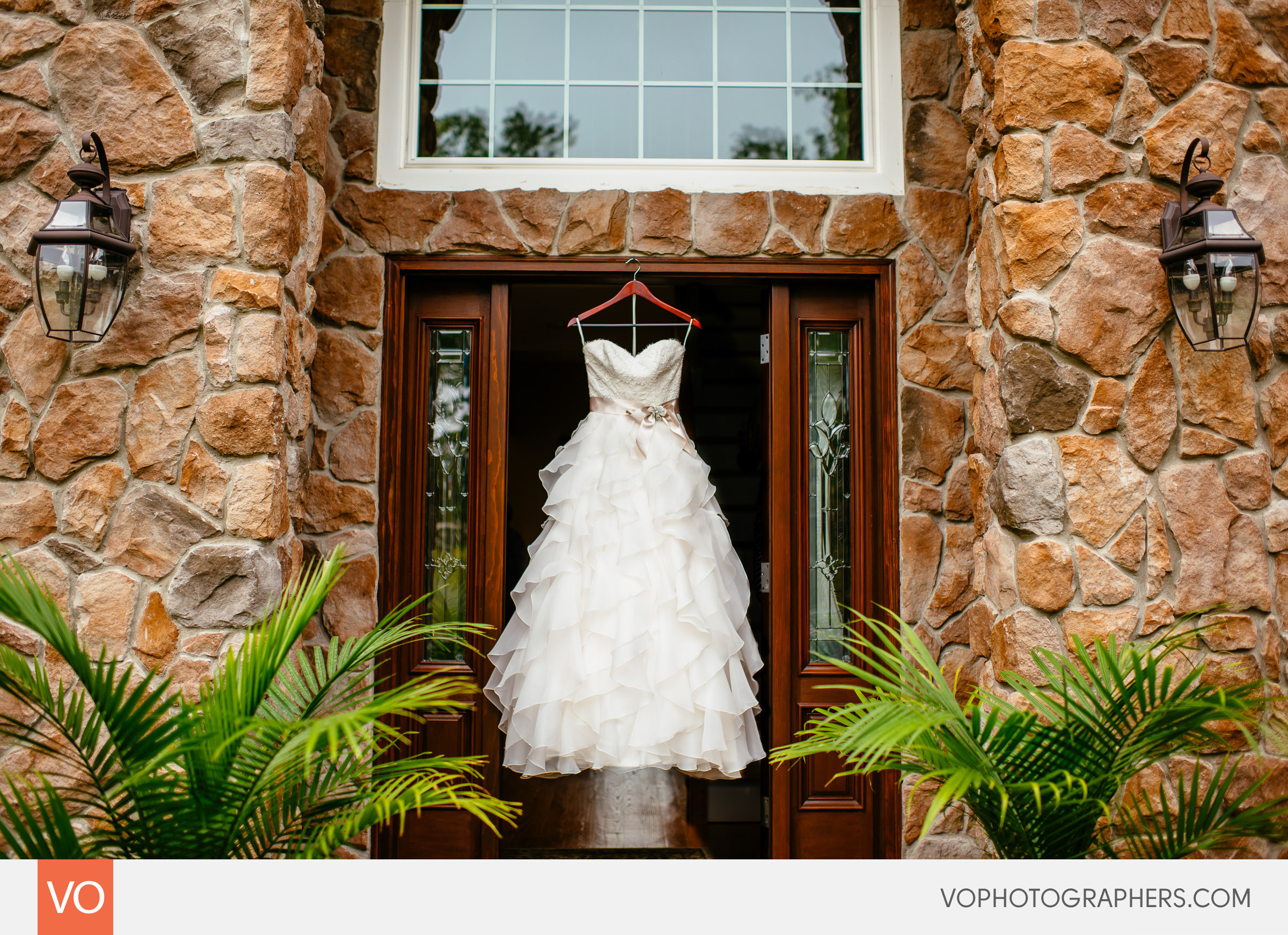 Wedding dress hanging in a doorway