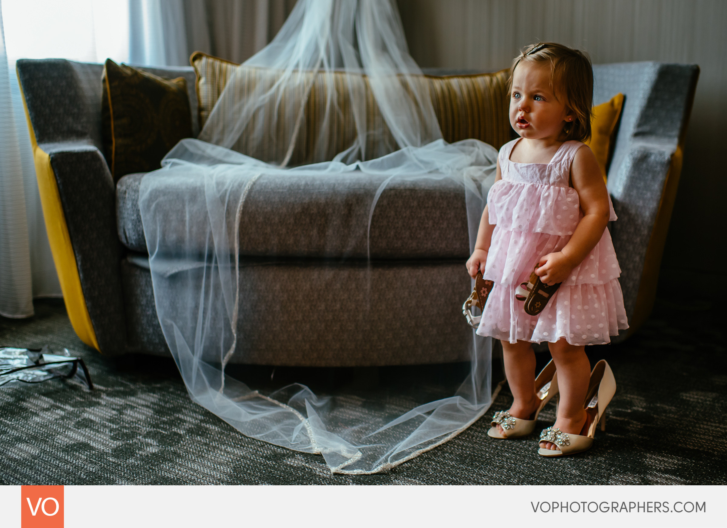 Bride's daughter wearing mom's shoes.